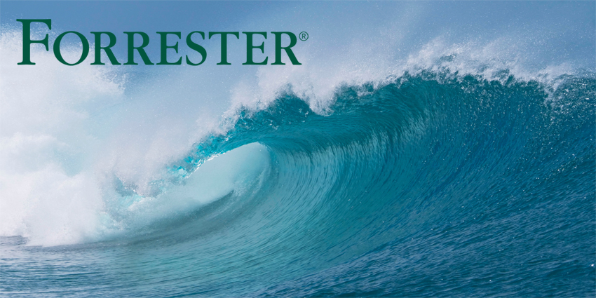 Beautiful deep blue tube wave in the Pacific curls on a sunny day.