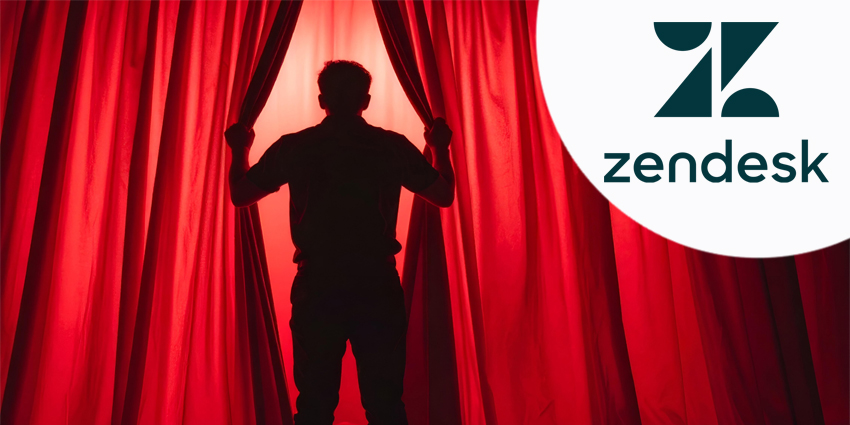 A person drawing back red curtains